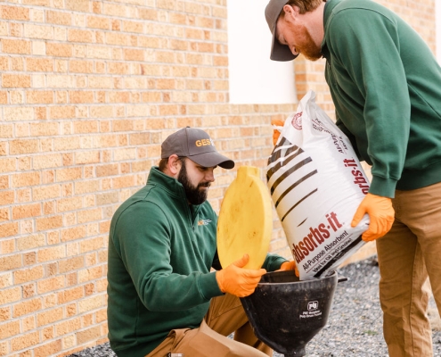 GES provides environmental services throughout Virginia. Pictured here two employees working at a residence.