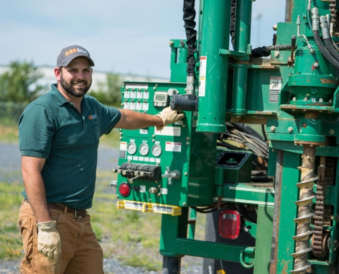 GES Employee Beside Drill Rig